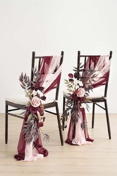 two chairs decorated with flowers and ribbons