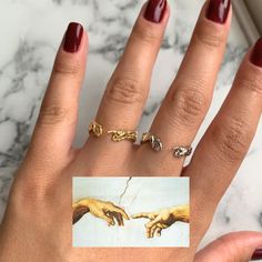 ☁ Hand of God Ring - Inspired by Michelangelo's Creation of Adam, this gold-plated, adjustable ring is the perfect blend of art and faith. A meaningful promise ring for him or a promise ring couple, this Christian ring carries vintage charm and infinity ring symbolism. 🤍 Features: Hypoallergenic, waterproof, anti-tarnish, and fits US sizes 5-10. Elevate your style with this unique Christian jewelry piece! ✨ #HandOfGodRing #PromiseRing Refunds/Returns: You have 14 days after receiving the produc Adjustable Symbolic Midi Rings For Wedding, Artistic Open Ring For Wedding, Artistic Adjustable Rings For Anniversary, Artistic Gold Wedding Rings, Ring Symbolism, Promise Rings For Him, Promise Rings For Couples, Infinity Ring, Couple Rings