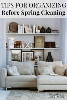 a living room filled with lots of furniture and bookshelves on top of shelves