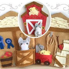 an assortment of felt farm animals and barnyards are shown in the shape of a house