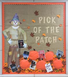 a bulletin board with an image of a scarecrow, pumpkins and other decorations