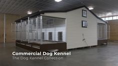 a dog kennel in the middle of a large building