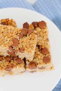 three pieces of granola bars on a white plate