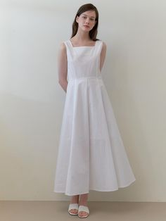 This is a minimal and unique dress by KINDABABY that is made out of high quality and sturdy fabric. With trendy design detail and feminine mood, you can style it for your daily casual outfit.- Square neckline and wide shoulder strap- Voluminous skirt silhouette- Zipper closure on center back White H-line Spring Dress, Modern A-line Cotton Dress, Modern White Sleeveless Midi Dress, Elegant Summer Dress For Everyday, Chic Everyday Midi Dress, White Sleeveless Dress With French Seams, Elegant Summer Midi Dress For Everyday, Chic Solid Dress For Everyday, Elegant Everyday Summer Midi Dress