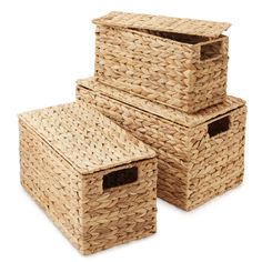 three woven storage baskets stacked on top of each other with their lids open and one closed