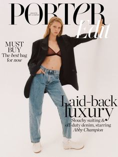 a woman is posing on the cover of a magazine with her hands in her pockets