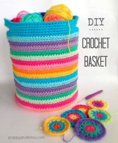 a crochet basket with two balls of yarn next to it