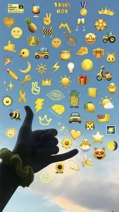 someone is holding their hand up to the sky with lots of emoticions on it