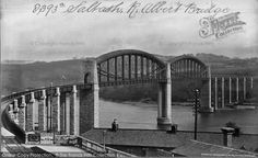 an old black and white photo of a bridge