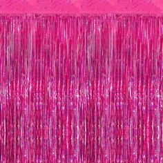 pink tinsel fringe curtain hanging from the ceiling