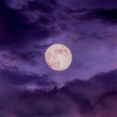 the full moon is shining brightly in the night sky with dark clouds and purple hues