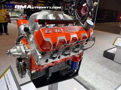 an orange and silver engine is on display