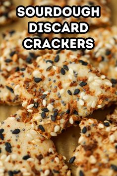 some sort of crackers with seeds on them and the words sourdough discard crackers above it