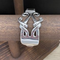 a close up of a metal object on a wooden table