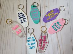 six key chains with different designs on them