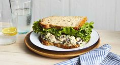 a sandwich with lettuce and blue cheese on a plate