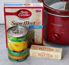 ingredients to make crock pot cake sitting next to an electric pressure cooker and box of butter