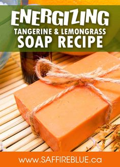 an orange soap bar sitting on top of a bamboo mat with the words energizing tangerine and lemongrass soap recipe