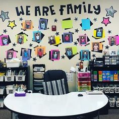 an office cubicle decorated with pictures, stars and the words we are family on it