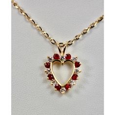 This is part of Chairish’s Fine Jewelry assortment.  Ruby Diamond Open Heart Pendant on 17″ Yellow Gold Chain 18K  I have owned this lovely Ruby Diamond Open Heart Pendant on Yellow Gold Chain for many years.  However, I feel it is time to share and give it a new home.  The beautiful heart measures 3/4" x 1/2" and is on a new unusual 17" chain.  Also, it weights 5.8 Grams Cute Promise Rings, Rubies And Diamonds, Body Accessories, Magical Jewelry, Heart Pendant Diamond, Jewel Box, Yellow Gold Chain, Ruby Diamond, Open Heart