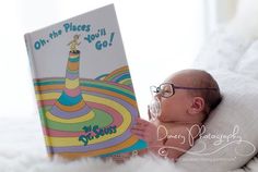 a baby reading a book with the caption oh, the places you'll go