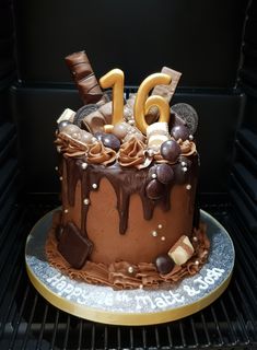 a cake with chocolate icing and decorations on it