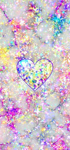 a heart is surrounded by colorful glitters