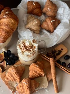 some croissants and other pastries on a table