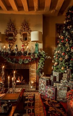 a living room filled with furniture and a fire place next to a christmas decorated tree