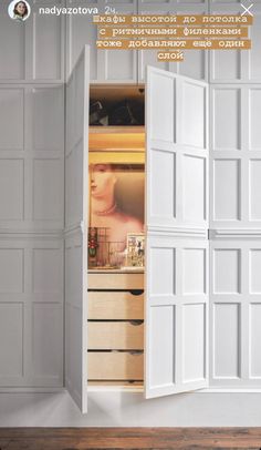 an open closet with white doors and drawers on the inside, in front of a wooden floor