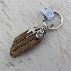 a keychain with a piece of driftwood attached to it