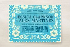 a blue and white wedding card with flowers on it