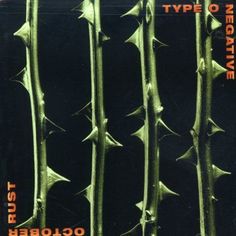 the cover art for type of negativee album, featuring green plants and black background