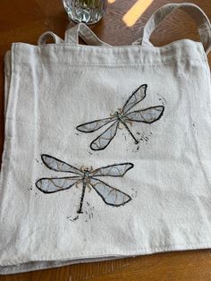 Dragonfly Tote Bag, hand painted with hand beaded, Cute Aesthetic Canvas Tote Bag, Reusable Grocery Bag Make your choice from two type of shapes: 1- square shape: measurements - Handle 11" inch ( 28 cm) - Bag length 16" inch ( 40cm) - Bag width 16" inch ( 40cm) - Bag depth 3.5" inch ( 9cm) 2- round shape: measurements  - Handle 10" inch ( 25.5 cm) - Bag length 12" inch ( 30.5 cm) - Bag width 15.5" inch ( 39.5 cm) - Bag depth 3.5" inch ( 9 cm) -Made of 100% cotton, organic and natural ingredients Tote Bag Diy Paint, Tote Bag Inspo Paint, Aesthetic Tote Bag Painting, Painting Tote Bag Ideas, Canvas Tote Bag Painting, Tote Bag Painting Ideas Aesthetic, Painted Tote Bag Ideas, Canvas Bag Painting Ideas, Cute Tote Bag Design