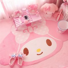 a pink rug with hello kitty on it