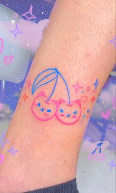 a small tattoo on the leg of a person with an umbrella and stars around it