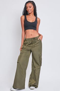 Every day is a new chance to wear our Women’s Relaxed Fit Cargo Pants. This high-waisted nylon pant features a relaxed fit for both style and comfort, ensuring you’ll look good and feel good throughout the day. Includes classic front pockets, three cargo pockets with button closures, and faux back pockets for maintaining a smoothing effect on your bum. These trendy pants are detailed with metal d-rings on the front belt loops and a drawstring waist so you can adjust the fit to your liking. Style