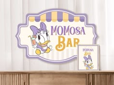 there is a sign that says momosa bar on the wall next to a cabinet