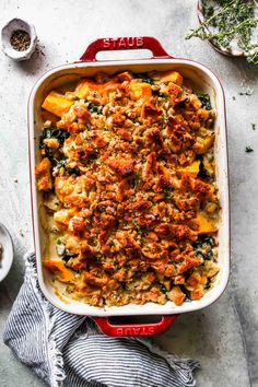 a casserole dish filled with meat and vegetables