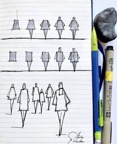 a notebook with some drawings on it and pens in front of the pages that are lined up next to each other