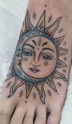 a sun and moon tattoo on the foot