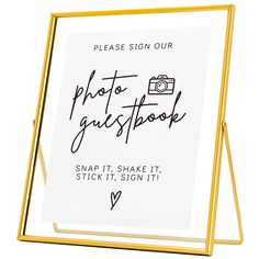 a sign that says, please sign our photo guestbook snap it shake it stick it