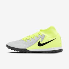 the nike merance soccer shoe is yellow and white with black detailing on the upper part