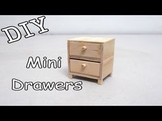 a small wooden drawer with the words diy mini drawers on it's side