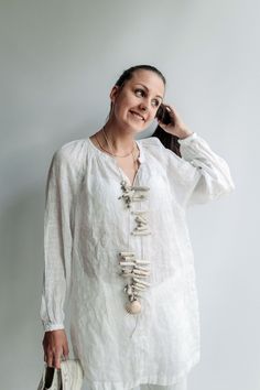 Sensual and airy. This light linen shirt is wonderful for hot summer days, milky evenings and dreamy nights. Made from light weight, pure linen with beautiful gather at cuffs and neckline. Long and sheer, this vintage inspired shirt tunic will be wonderful to wear as a cover up on the beach, after spa or if you want to wear it in more formal settings, styling with a vest and pants will make it a statement piece. Each piece is individually cut, sawn and pre-washed. Let us know your height and bus Flowy Tunic Blouse For Beach Cover-up, Bohemian Tunic Cover-up For Loungewear, Bohemian Linen Tunic For Beach Cover-up, Summer Cotton Tunic Cover-up, White Cotton Beach Cover-up Tunic, Linen Tunic Tops, White Linen Shirt, Linen Dress Women, Linen Tunic