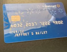 a blue walmart credit card with snowflakes on it's back side