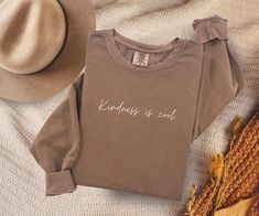 This Kindness is Cool Sweatshirt is the perfect gift for teachers or anyone who values kindness. Made from 100% ring-spun cotton, this lightweight crewneck sweatshirt offers a relaxed fit and features a comfy saying that exudes a positive vibe. It is ideal for casual wear or to spread a message of kindness during holidays, teacher appreciation week, or just everyday life. Product features - 100% ring-spun cotton for durability and smooth fabric - 1x1 ribbed cuffs and bottom hem for a well-fitted garment - Shoulder and neck tape for stability and prevent stretching - Without side seams for reduced fabric waste and attractive design - Lightweight fabric for comfort (6.4 oz/yd²) Care instructions - Machine wash: cold (max 30C or 90F) - Do not bleach - Tumble dry: low heat - Iron, steam or dry Kindness Gifts, Sweatshirts Quotes, Teacher Appreciation Week, Comfy Sweatshirt, Gift For Teacher, Lightweight Sweater, Cool Stuff, Light Weight Sweater, Teacher Appreciation