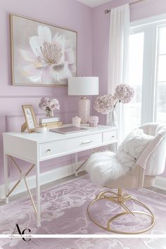 a white desk sitting in front of a window next to a chair and table with flowers on it