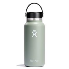 the hydro flask water bottle is shown in light green with black lid and handle