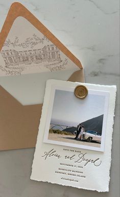 an envelope with a wedding photo on it and a wax stamp attached to the front